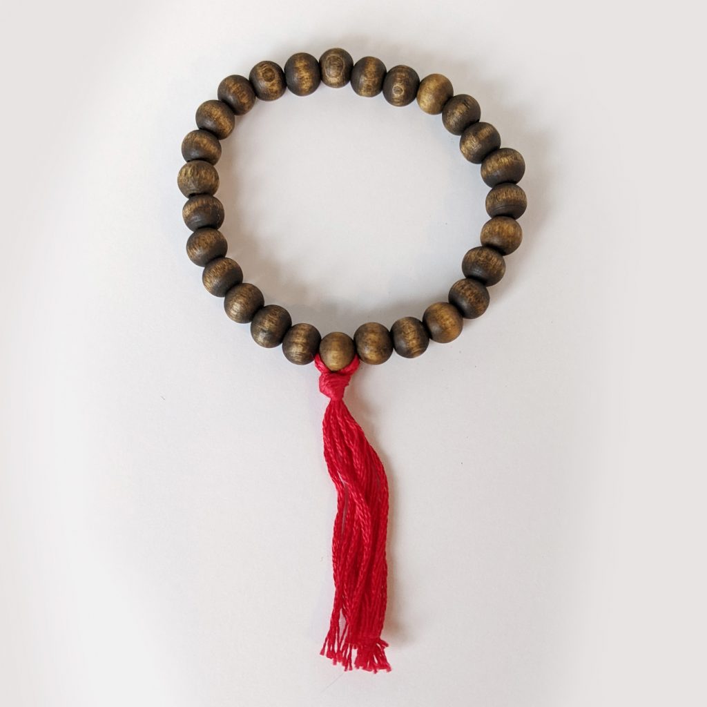 Wooden Bead Bracelets - hand made with red tassle for root chakra