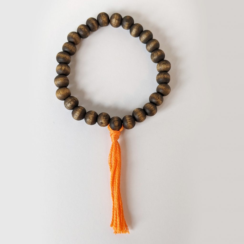 Wooden Bead Bracelets - hand made with orange tassel for root chakra