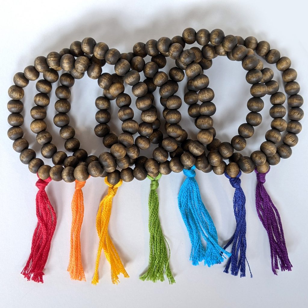 Set of seven (7) wooden bead bracelets representing each of the Chakras